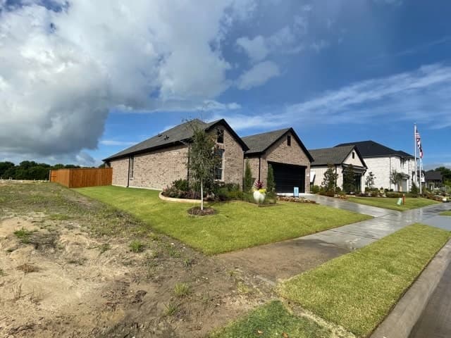 Newly completed homes with graded lots in a North Central Texas subdivision, where elevation certificates are prepared.