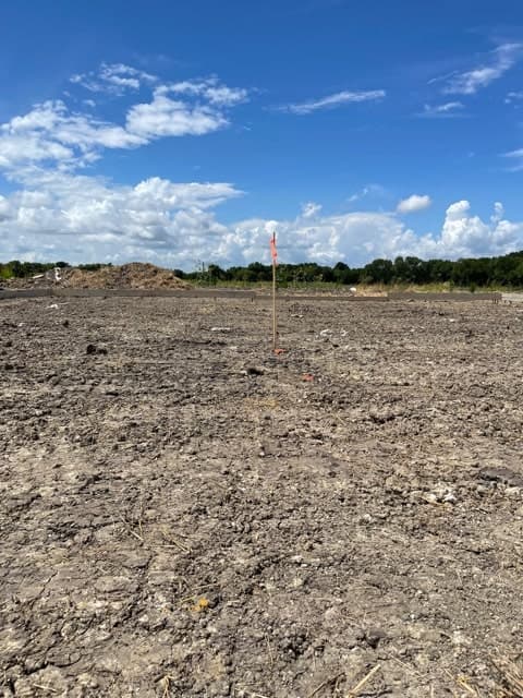 Compacted building pad on a builder lot ahead of forming.