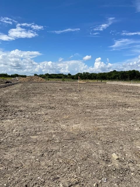 Residential building pad graded to plan elevation on a North Central Texas jobsite.